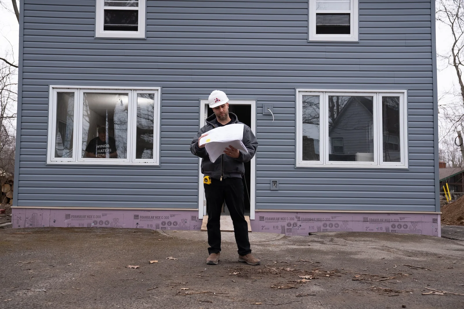 DKI Miller project manager outside a Niagara home after a sewage cleanup